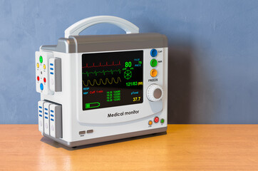 Patient Medical Monitor on the wooden table. 3D rendering