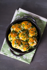 Buns Pampushky - Ukrainian garlic bread. Bread rolls with garlic and parsley. View from above, top studio shot
