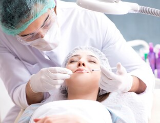 Naklejka premium Woman visiting doctor for plastic surgery