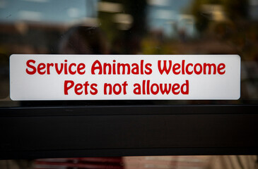 Sign stating Service Animals Welcome Pets Not Allowed