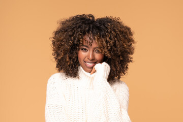 Afro girl in cozy fashionable sweater.
