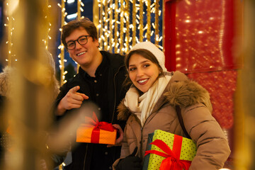 Fototapeta premium Happy couple heaving fun at a Christmas fairy