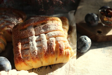Baking from sweet yeast dough with fruits inside close-up, homemade bread.