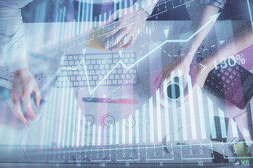 Double exposure of man and woman working together and financial chart hologram drawing. market analysis concept. Computer background. Top View.