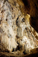 The calcite in the mineral water creates castings and stalactites within the natural caves.