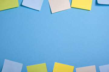 bright colored sticky notes on blue background