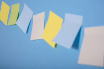 bright colored sticky notes on blue background