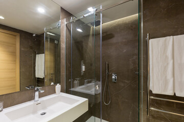 Interior of a hotel bathroom interior with shower cabin