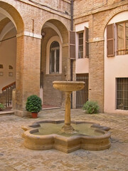 Fototapeta na wymiar Italy, Marche, Macerata, antique fountain inside the town hall.