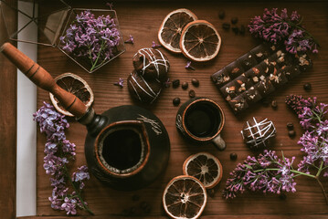 Still life with chocolate, lemons and lilac