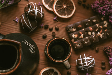 Still life with chocolate, lemons and lilac