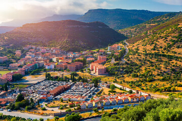 Aerial view of the beautiful village of Bosa with colored houses and a medieval castle. Bosa is located in the north-wesh of Sardinia, Italy. Aerial view of colorful houses in Bosa village, Sardegna.