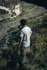 Boy watching from the top of a canyon the landscape
