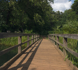 Fototapeta na wymiar wooden bridge in the river