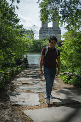 Young man walking in central park