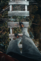 Feet walking in a wood bridge