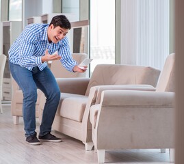 Young man shopping in furniture store