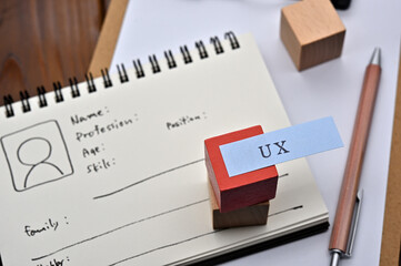 A note with the user's persona written on it is placed on a clipboard along with a pen. A sticky note stamped with 