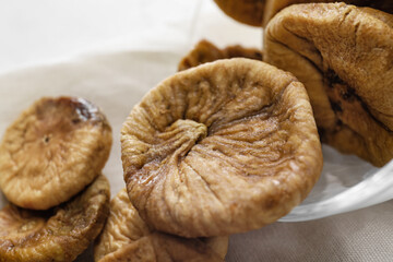 Tasty dried figs on light background, closeup