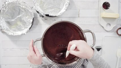 Flat lay. Step by step. Mixing ingredients in the cooking pot to make simple chocolate fudge.