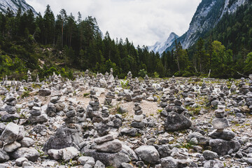 view on isar river and mountains near the isar origin in scharnitz, austria