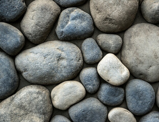 Stone background. Wall of rounded pebbles.