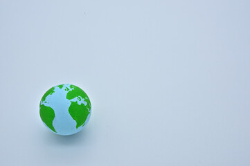 The ball of the earth is on a wooden board, and the Atlantic Ocean is visible.