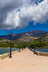 View of the De Bosset Bridge in Argostoli city on Kefalonia island. De Bosset Bridge on lakeside In Argostoli, Kefalonia. Obelisk and the de Bosset bridge in Argostoli, Kefalonia, Greece