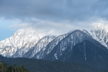 Fototapeta na wymiar snow mountains and forests