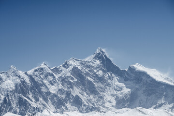 Fototapeta na wymiar mountain peak against a blue sky