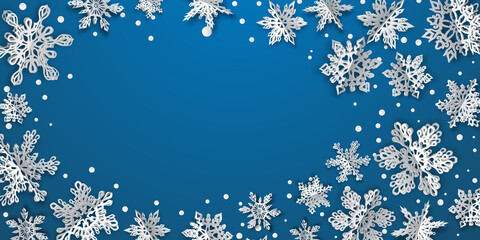 Christmas background with volume paper snowflakes with soft shadows on blue background