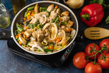 Roasting pork with vegetables, on the background of fresh ingredients and vegetables, culinary recipes