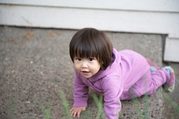 baby on purple having fun 