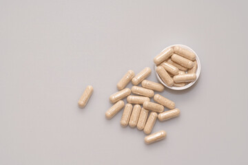vegetarian capsules laid on white table isolated