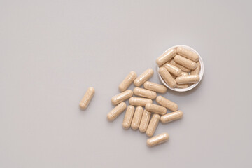 vegetarian capsules laid on white table isolated