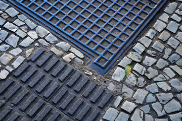 Sidewalk mosaic and manhole cover detail