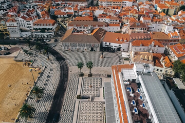 Top view of the city, narrow streets and roofs of houses with red tiles Cascais.