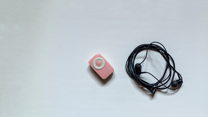 mp3 player with headphone on white background