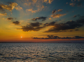 Sunrise over the ocean with beautiful cloudscape