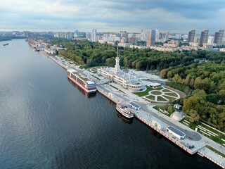 Obraz premium Aerial view is a beautiful panorama of the renovated Northern River Station in Moscow. Colorful landscape of the city and the river at sunset. River cruises