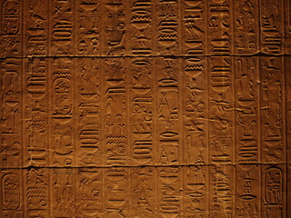 Hieroglyphics in Egypt. Ancient symbolic inscriptions carved in stone.