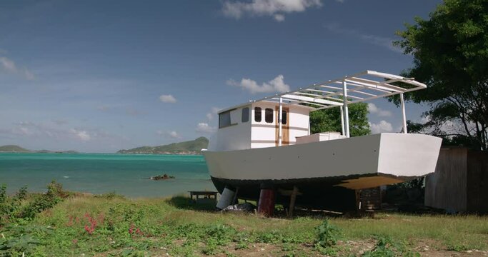 Traditional sloop boat being constructe, with island views, Windward, Carriacou, Grenada