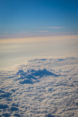 Sky and clouds from above the ground viewed from an airplane