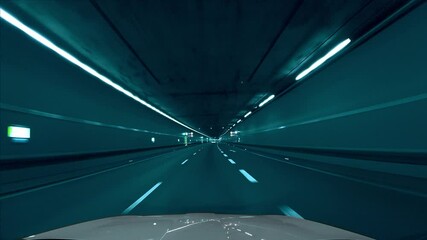 Fast drive by car through a tunnel in the Tenet movie / film look, with cyan, light bluish color tones. Following a car from the front window view with a speed ramp effect. - Powered by Adobe