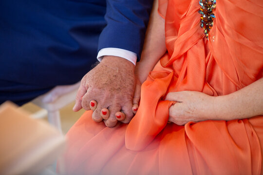 Older Couple Holding Hands Close Up