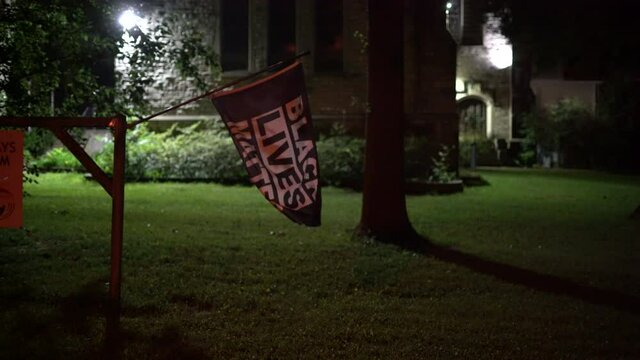 Black lives matter flag in the wind, racial injustice, BLM, black lives matter sign, racial movement, 