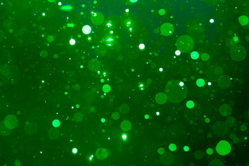 green bokeh on black background