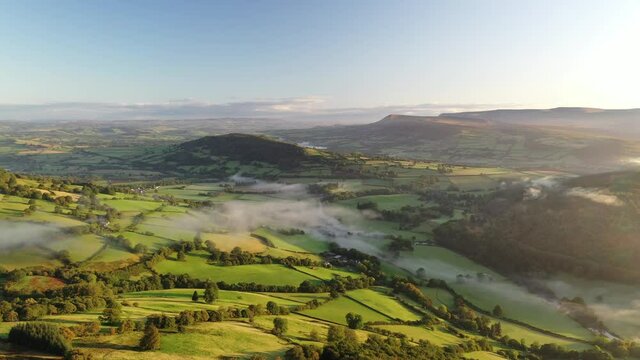 Aerial clip of rolling countryside of the Usk Valley, Brecon Beacons National Park, Powys, Wales
