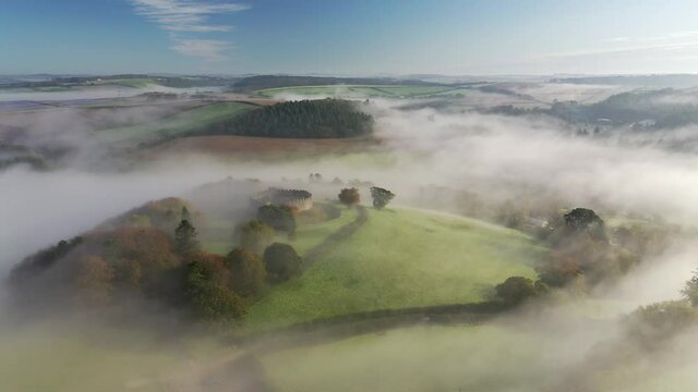Aerial clip of Restormel Castle on a misty autumn morning, Lostwithiel, Cornwall, England