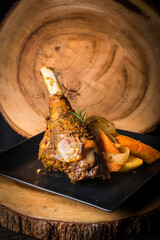 Sholder of Lamb cooked in the oven and served with roast vegetables